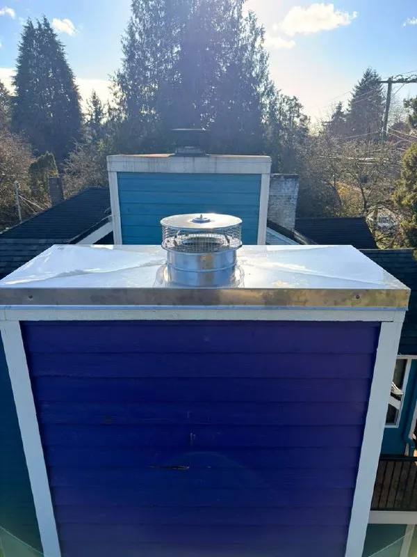 The same chimney with a new metal crown cover and a stainless cap