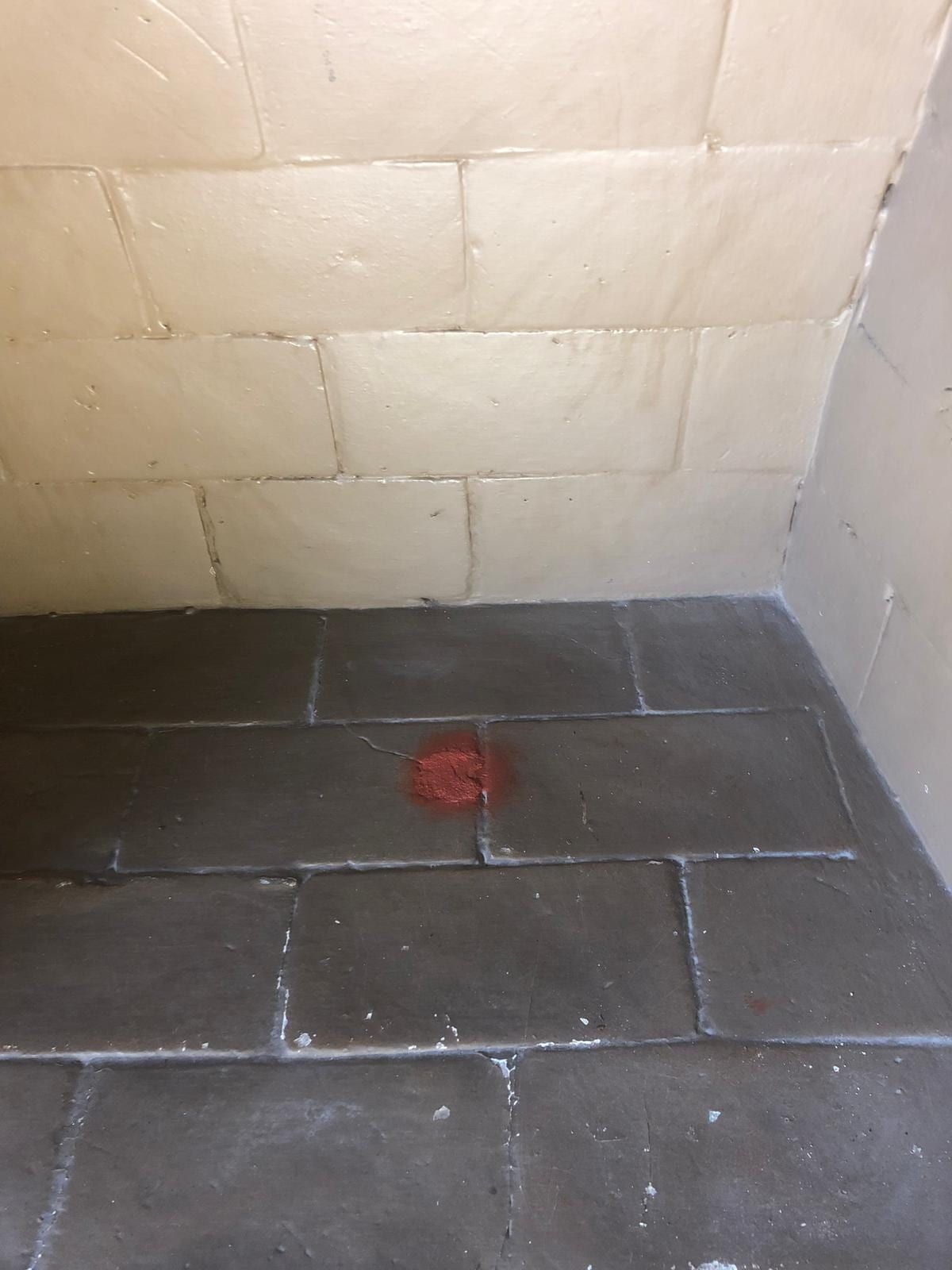 A swept firebox with the block wall and tiled floor visible again